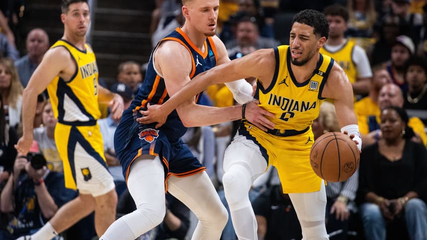 May 12, 2024; Indianapolis, Indiana, USA;  Indiana Pacers guard Tyrese Haliburton (0) dribbles the ball while New York Knicks guard Donte DiVincenzo (0) defends during game four of the second round for the 2024 NBA playoffs at Gainbridge Fieldhouse. Mandatory Credit: Trevor Ruszkowski-USA TODAY Sports