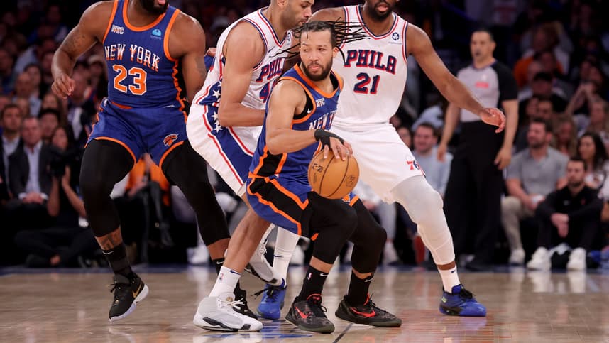 Apr 30, 2024; New York, New York, USA; New York Knicks guard Jalen Brunson (11) handles the ball against Philadelphia 76ers forward Nicolas Batum (40) and center Joel Embiid (21) during the first quarter of game 5 of the first round of the 2024 NBA playoffs at Madison Square Garden. Mandatory Credit: Brad Penner-USA TODAY Sports