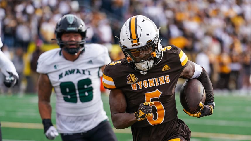 Nov 18, 2023; Laramie, Wyoming, USA; Wyoming Cowboys wide receiver Ayir Asante (New York Giants) (5) scores a touchdown against the Hawaii Rainbow Warriors during the second quarter at Jonah Field at War Memorial Stadium. Mandatory Credit: Troy Babbitt-USA TODAY Sports