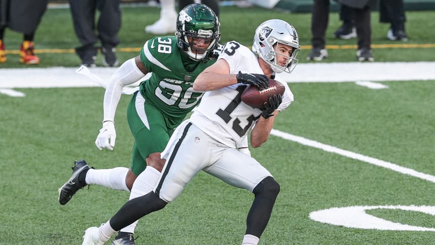 Dec 6, 2020; East Rutherford, New Jersey, USA; Las Vegas Raiders wide receiver Hunter Renfrow (13) catches the ball as New York Jets cornerback Lamar Jackson (38) pursues during the first half at MetLife Stadium. Mandatory Credit: Vincent Carchietta-USA TODAY Sports