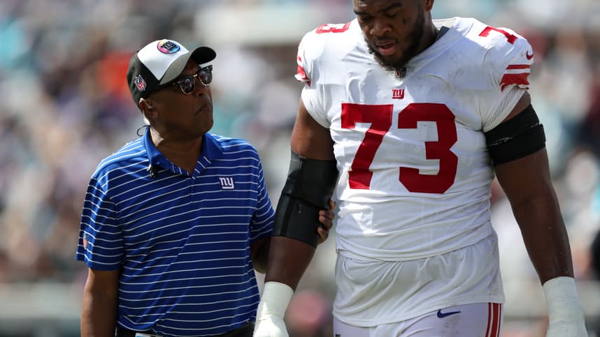 Oct 23, 2022; Jacksonville, Florida, USA;  New York Giants offensive tackle Evan Neal (73) leaves the field with an injury against the Jacksonville Jaguars in the second quarter at TIAA Bank Field. Mandatory Credit: Nathan Ray Seebeck-USA TODAY Sports