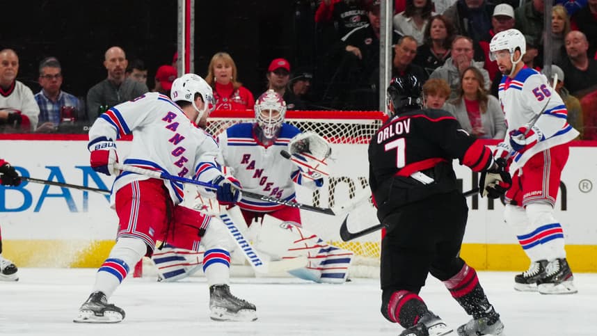 Mar 12, 2024; Raleigh, North Carolina, USA; Carolina Hurricanes defenseman Dmitry Orlov (7) takes a shot against the New York Rangers during the second period at PNC Arena. Mandatory Credit: James Guillory-USA TODAY Sports