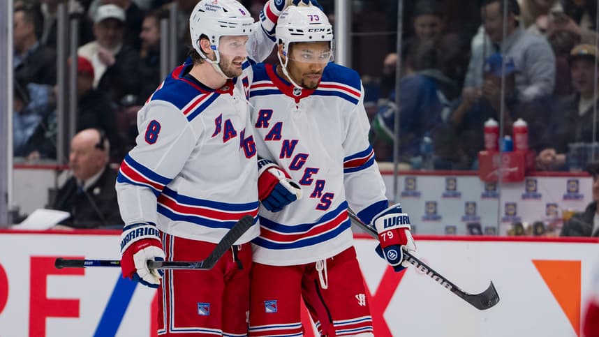Feb 15, 2023; Vancouver, British Columbia, CAN; New York Rangers defenseman Jacob Trouba (8) celebrates defenseman K'Andre Miller (79) goal against the Vancouver Canucks in the second period at Rogers Arena. Mandatory Credit: Bob Frid-USA TODAY Sports