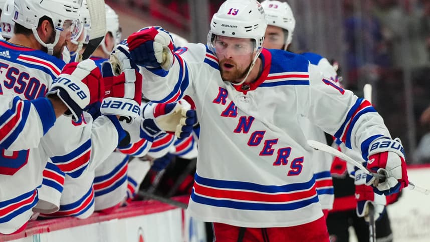 May 11, 2024; Raleigh, North Carolina, USA; New York Rangers left wing Alexis Lafrenière (13) celebrates after scoring a goal against the Carolina Hurricanes during the third period in game four of the second round of the 2024 Stanley Cup Playoffs at PNC Arena. Mandatory Credit: James Guillory-USA TODAY Sports