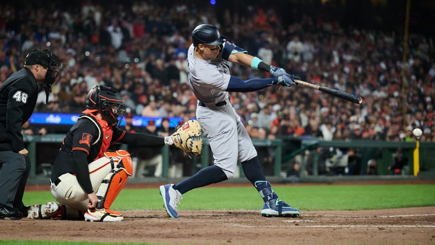 Jun 1, 2024; San Francisco, California, USA; New York Yankees outfielder Aaron Judge (99) hits a single against the San Francisco Giants during the eighth inning at Oracle Park. Mandatory Credit: Robert Edwards-USA TODAY Sports