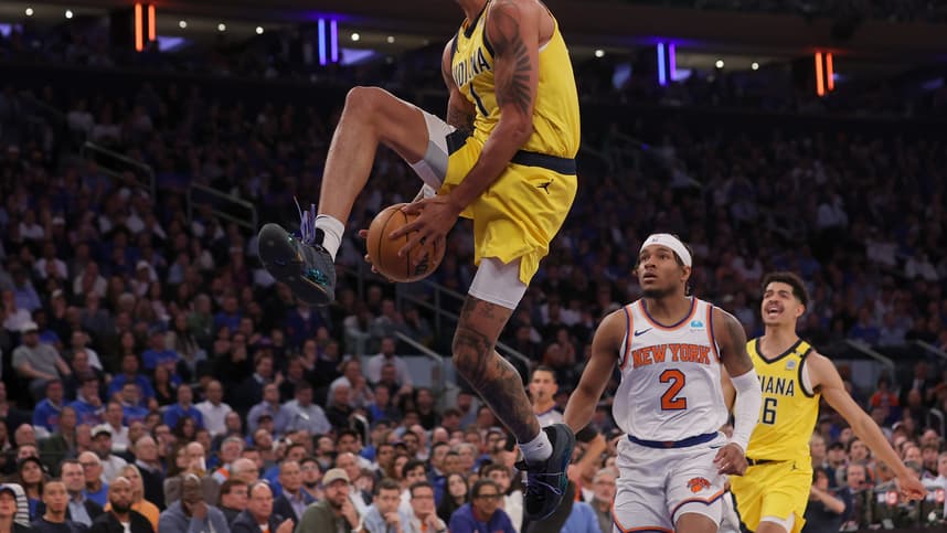 May 6, 2024; New York, New York, USA; Indiana Pacers forward Obi Toppin (1) dunks against New York Knicks guard Miles McBride (2) during the third quarter of game one of the second round of the 2024 NBA playoffs at Madison Square Garden. Mandatory Credit: Brad Penner-USA TODAY Sports