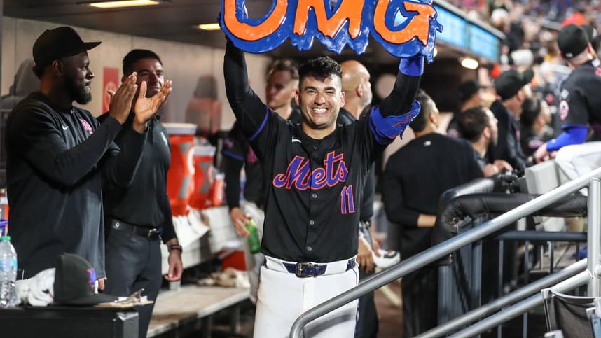 Jul 12, 2024; New York City, New York, USA;  New York Mets second baseman Jose Iglesias (11) celebrates in the dugout after hitting a solo home run in the fifth inning against the Colorado Rockies at Citi Field. Mandatory Credit: Wendell Cruz-USA TODAY Sports