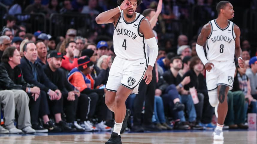 Mar 23, 2024; New York, New York, USA;  Brooklyn Nets guard Dennis Smith Jr. (4) gestures after making a three point shot in the fourth quarter against the New York Knicks at Madison Square Garden. Mandatory Credit: Wendell Cruz-USA TODAY Sports