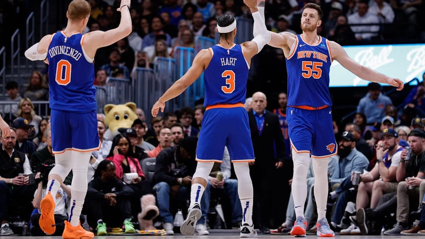 Mar 21, 2024; Denver, Colorado, USA; New York Knicks center Isaiah Hartenstein (55) reacts with guard Josh Hart (3) and guard Donte DiVincenzo (0) in the second quarter against the Denver Nuggets at Ball Arena. Mandatory Credit: Isaiah J. Downing-USA TODAY Sports