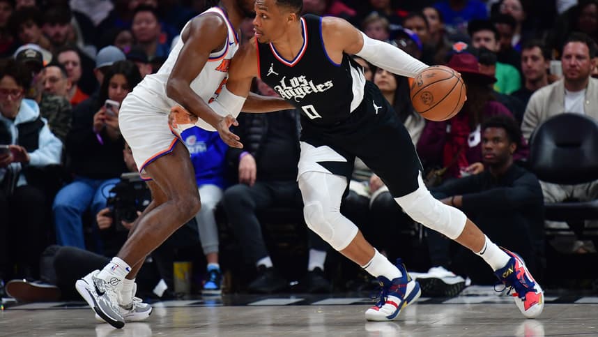 Dec 16, 2023; Los Angeles, California, USA; Los Angeles Clippers guard Russell Westbrook (0) moves the ball against New York Knicks guard Immanuel Quickley (5) during the second half at Crypto.com Arena. Mandatory Credit: Gary A. Vasquez-USA TODAY Sports