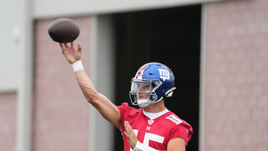 Jul 25, 2024; East Rutherford, NY, USA; New York Giants quarterback Tommy DeVito (15) throws a pass during training camp at Quest Diagnostics Training Center. Mandatory Credit: Lucas Boland-USA TODAY Sports