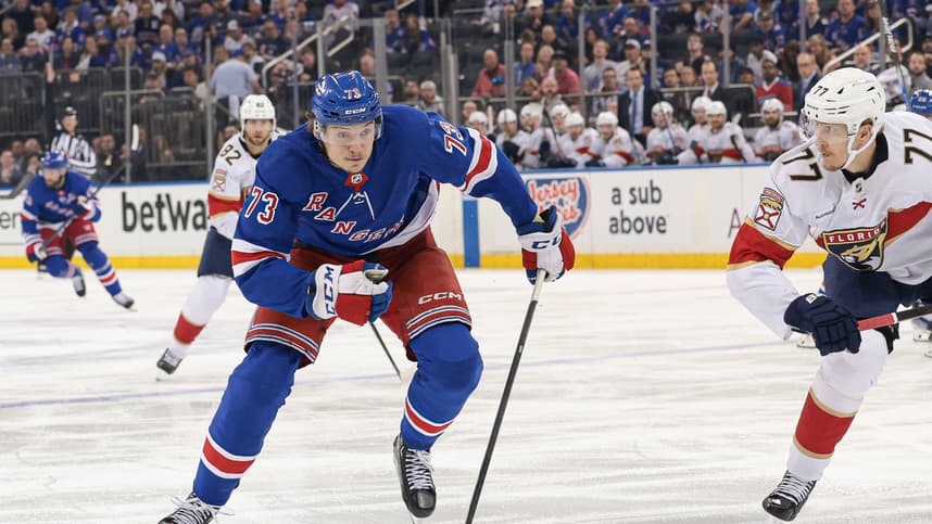 May 24, 2024; New York, New York, USA; New York Rangers center Matt Rempe (73) skates up ice as Florida Panthers defenseman Niko Mikkola (77) defends during the second period in game two of the Eastern Conference Final of the 2024 Stanley Cup Playoffs at Madison Square Garden. Mandatory Credit: Vincent Carchietta-USA TODAY Sports