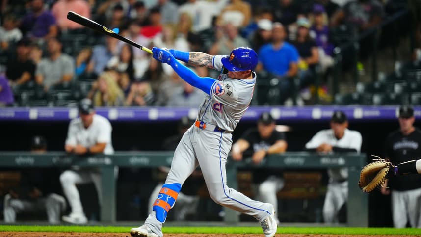 Aug 7, 2024; Denver, Colorado, USA; New York Mets outfielder Ben Gamel (21) singles in the seventh inning against the Colorado Rockies at Coors Field. Mandatory Credit: Ron Chenoy-USA TODAY Sports