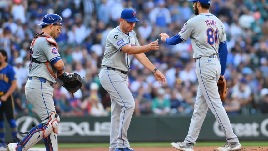 Aug 11, 2024; Seattle, Washington, USA; New York Mets manager Carlos Mendoza (64) pulls relief pitcher Danny Young (81) from the game during the seventh inning against the Seattle Mariners at T-Mobile Park. Mandatory Credit: Steven Bisig-USA TODAY Sports