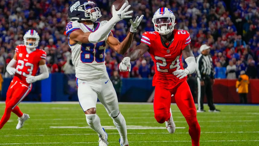 Oct 15, 2023; Orchard Park, New York, USA; New York Giants wide receiver Darius Slayton (86) makes a catch against Buffalo Bills cornerback Kaiir Elam (24) during the first half at Highmark Stadium. Mandatory Credit: Gregory Fisher-USA TODAY Sports