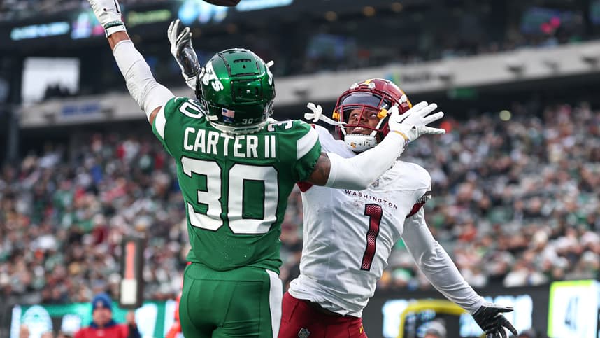 Dec 24, 2023; East Rutherford, New Jersey, USA; New York Jets cornerback Michael Carter II (30) breaks up a pass intended for Washington Commanders wide receiver Jahan Dotson (1) during the second half at MetLife Stadium. Mandatory Credit: Vincent Carchietta-USA TODAY Sports