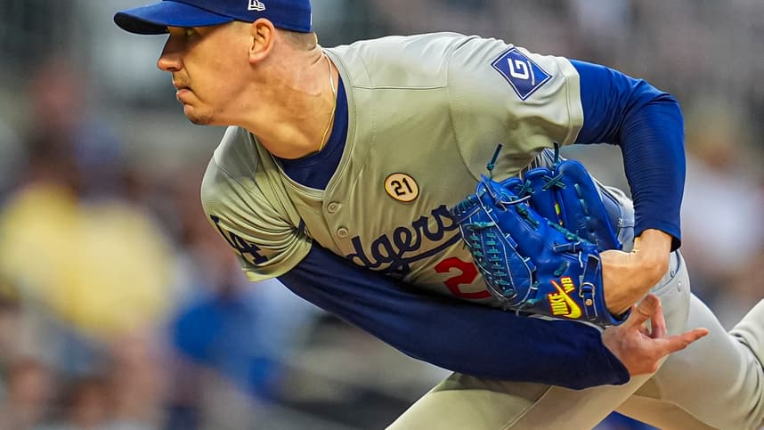 Sep 15, 2024; Cumberland, Georgia, USA; Los Angeles Dodgers starting pitcher Walker Buehler (21) pitches against the Atlanta Braves during the first inning at Truist Park. Mandatory Credit: Dale Zanine-Imagn Images