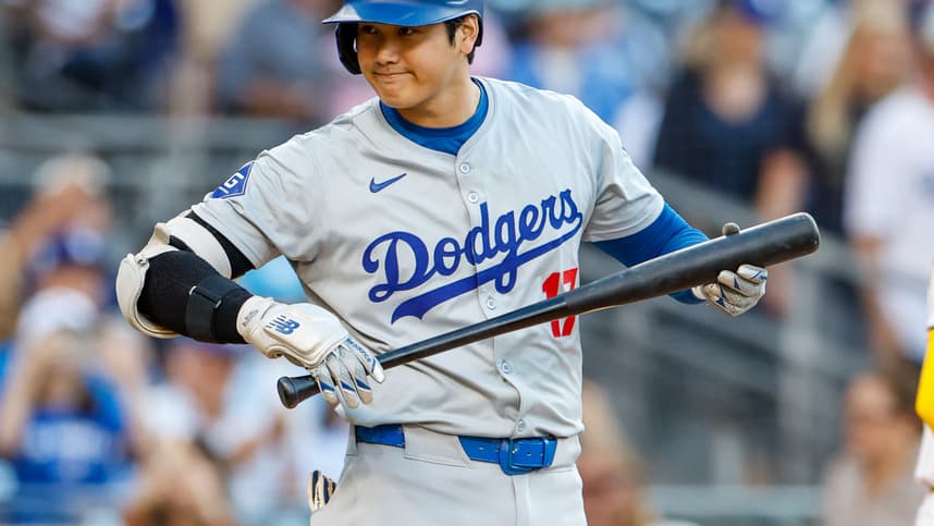 Jul 30, 2024; San Diego, California, USA;  Los Angeles Dodgers designated hitter Shohei Ohtani (17) looks into the San Diego Padres dugout before his at bat during the first inning at Petco Park. Mandatory Credit: David Frerker-Imagn Images