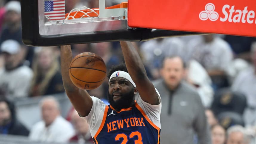 Apr 15, 2023; Cleveland, Ohio, USA; New York Knicks center Mitchell Robinson (23) dunks against the Cleveland Cavaliers in the first quarter of game one of the 2023 NBA playoffs at Rocket Mortgage FieldHouse. Mandatory Credit: David Richard-Imagn Images