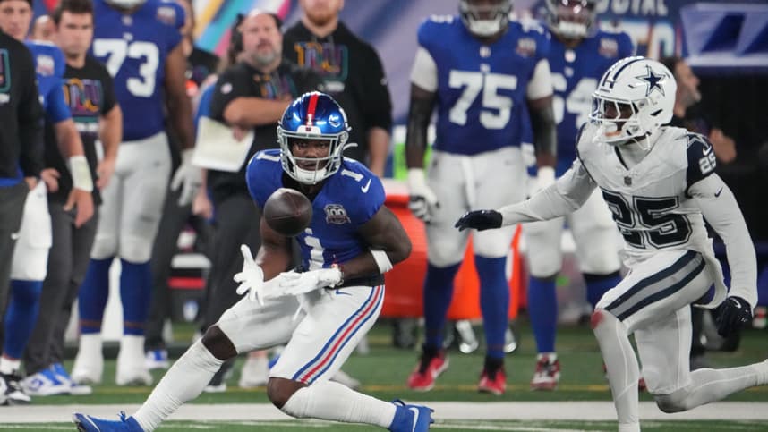 Sep 26, 2024; East Rutherford, New Jersey, USA;  New York Giants wide receiver Malik Nabers (1) gathers in a pass in front of Dallas Cowboys cornerback Andrew Booth Jr. (25) in the first half at MetLife Stadium. Mandatory Credit: Robert Deutsch-Imagn Images
