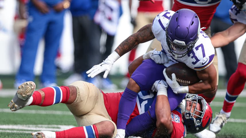 Sep 8, 2024; East Rutherford, New Jersey, USA; Minnesota Vikings running back Miles Gaskin (37) is tackled by New York Giants linebacker Darius Muasau (53) during the second half at MetLife Stadium. Mandatory Credit: Vincent Carchietta-Imagn Images