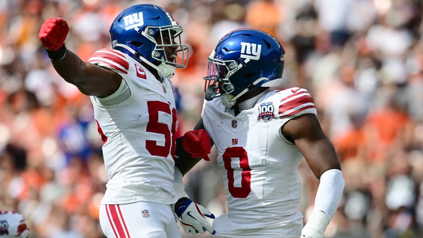 Sep 22, 2024; Cleveland, Ohio, USA; New York Giants linebacker Bobby Okereke (58) and linebacker Brian Burns (0) celebrate after Burns strip sacked Cleveland Browns quarterback Deshaun Watson (not pictured) during the first half at Huntington Bank Field. Mandatory Credit: Ken Blaze-Imagn Images