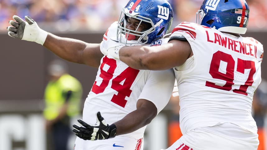 Sep 22, 2024; Cleveland, Ohio, USA; New York Giants defensive tackle Dexter Lawrence II (97) congratulates defensive tackle Elijah Chatman (94) on his sack against the Cleveland Browns during the first quarter at Huntington Bank Field. Mandatory Credit: Scott Galvin-Imagn Images