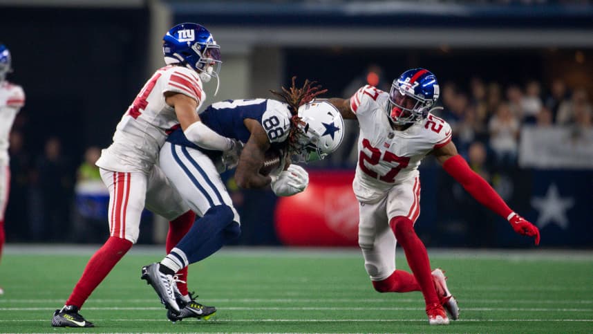 Nov 24, 2022; Arlington, Texas, USA; Dallas Cowboys wide receiver CeeDee Lamb (88) and New York Giants cornerback Nick McCloud (44) and cornerback Jason Pinnock (27) in action during the game between the Dallas Cowboys and the New York Giants at AT&T Stadium. Mandatory Credit: Jerome Miron-Imagn Images