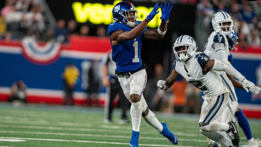 Sep 26, 2024; East Rutherford, NJ, US; New York Giants wide receiver Malik Nabers (1) catches a pass in the fourth quarter before being tackled by Dallas Cowboys cornerback Jourdan Lewis (2) at MetLife Stadium. Mandatory Credit: Julian Guadalupe-NorthJersey.com