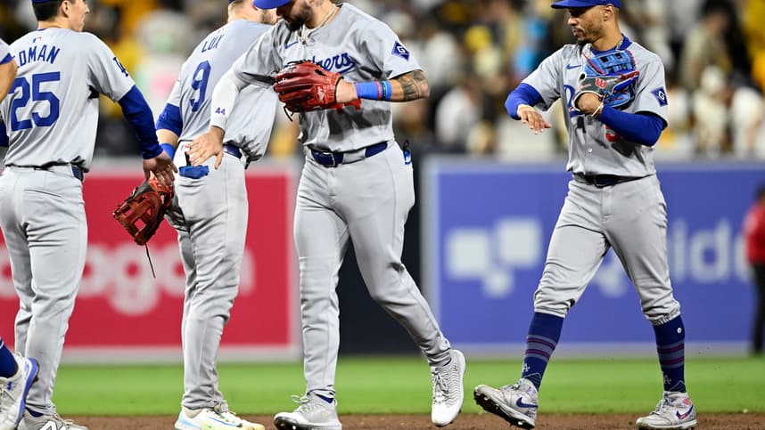 Oct 9, 2024; San Diego, California, USA; Los Angeles Dodgers outfielder Andy Pages (44) and shortstop Mookie Betts (50) celebrate with teammates after winning game four of the NLDS for the 2024 MLB Playoffs against the San Diego Padres at Petco Park.  Mandatory Credit: Denis Poroy-Imagn Images