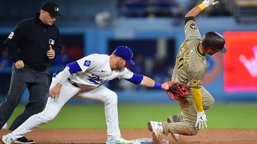 Sep 24, 2024; Los Angeles, California, USA; San Diego Padres catcher Kyle Higashioka (20) steals second against Los Angeles Dodgers second baseman Gavin Lux (9) during the seventh inning at Dodger Stadium. Mandatory Credit: Gary A. Vasquez-Imagn Images