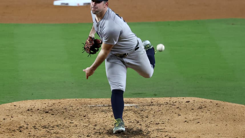 Oct 26, 2024; Los Angeles, California, USA; New York Yankees pitcher Carlos Rodon (55) throws a pitch against the Los Angeles Dodgers in the fourth inning for game two of the 2024 MLB World Series at Dodger Stadium. Mandatory Credit: Kiyoshi Mio-Imagn Images