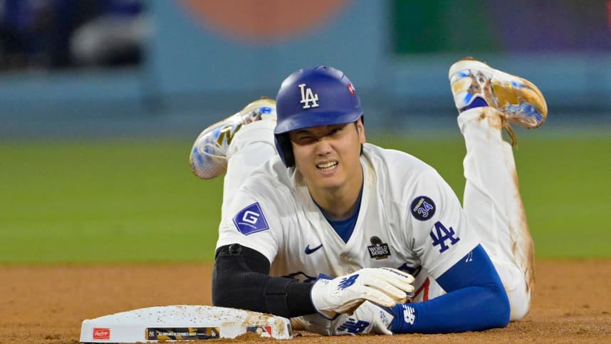 Oct 26, 2024; Los Angeles, California, USA; Los Angeles Dodgers designated hitter Shohei Ohtani (17) reacts at second base after an apparent injury in the seventh inning against the New York Yankees during game two of the 2024 MLB World Series at Dodger Stadium. Mandatory Credit: Jayne Kamin-Oncea-Imagn Images