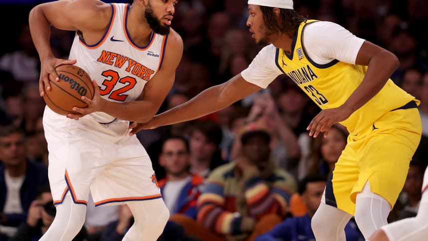 Oct 25, 2024; New York, New York, USA; New York Knicks center Karl-Anthony Towns (32) controls the ball against Indiana Pacers center Myles Turner (33) during the second quarter at Madison Square Garden. Mandatory Credit: Brad Penner-Imagn Images