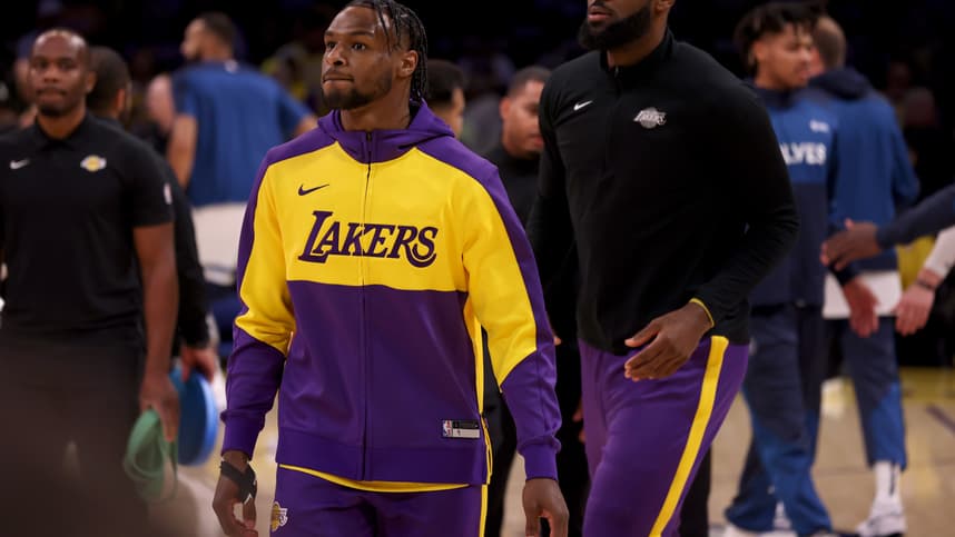 Oct 22, 2024; Los Angeles, California, USA; Los Angeles Lakers guard Bronny James (9) and forward LeBron James (23) warm up before a game against the Minnesota Timberwolves at Crypto.com Arena. Mandatory Credit: Jason Parkhurst-Imagn Images
