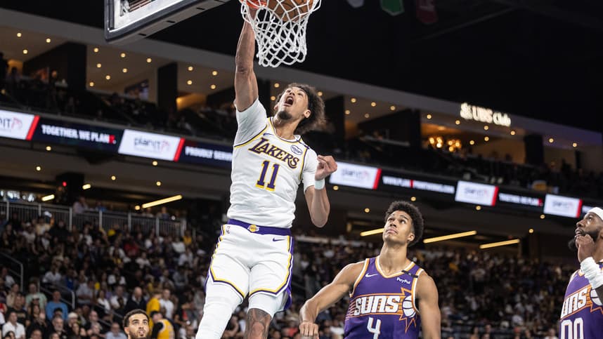 Oct 6, 2024; Palm Desert, California, USA; Los Angeles Lakers center Jaxson Hayes (11) dunks over Phoenix Suns center Oso Ighodaro (4) during the second half at Acrisure Arena. Mandatory Credit: David Frerker-Imagn Images
