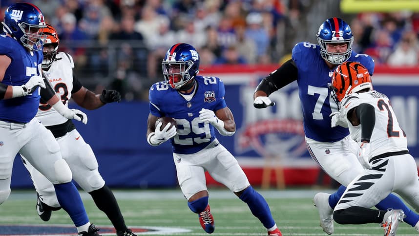 Oct 13, 2024; East Rutherford, New Jersey, USA; New York Giants running back Tyrone Tracy Jr. (29) runs with the ball against the Cincinnati Bengals during the first quarter at MetLife Stadium. Mandatory Credit: Brad Penner-Imagn Images
