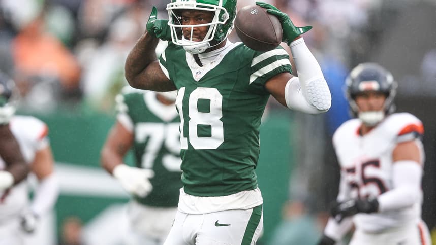 Sep 29, 2024; East Rutherford, New Jersey, USA; New York Jets wide receiver Mike Williams (18) celebrates a first down reception during the second half against the Denver Broncos at MetLife Stadium. Mandatory Credit: Vincent Carchietta-Imagn Images