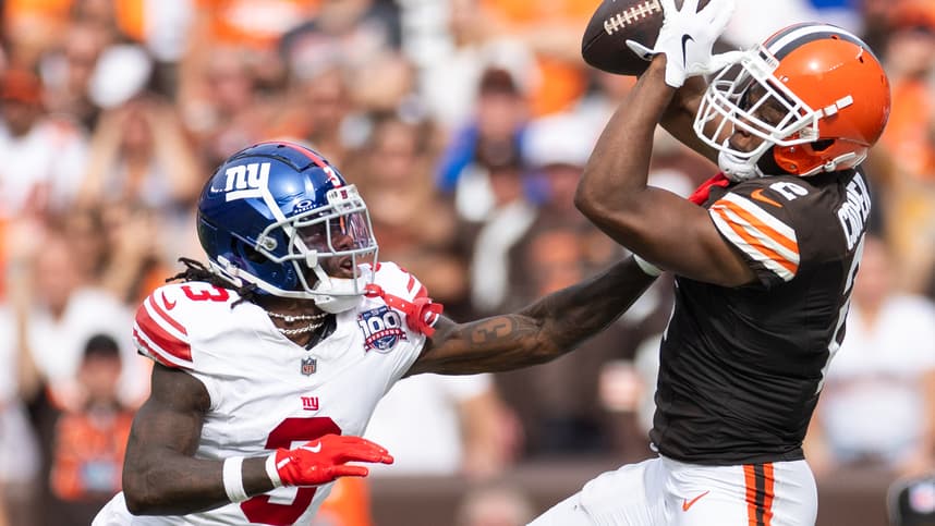 Sep 22, 2024; Cleveland, Ohio, USA; Cleveland Browns wide receiver Amari Cooper (2) catches the ball under coverage by New York Giants cornerback Deonte Banks (3) during the fourth quarter at Huntington Bank Field. Mandatory Credit: Scott Galvin-Imagn Images