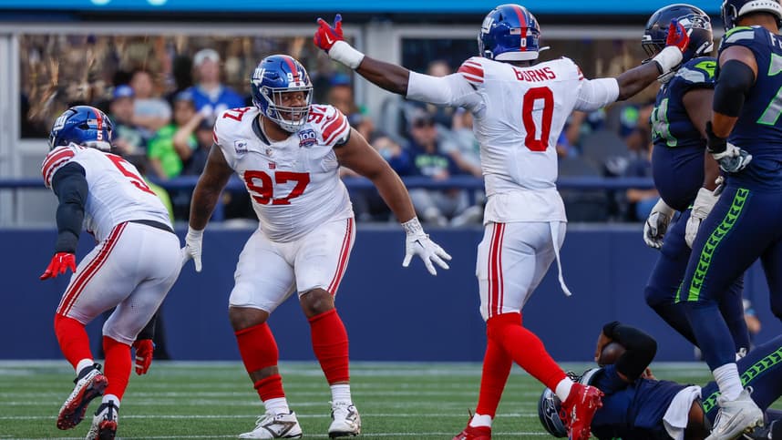 Oct 6, 2024; Seattle, Washington, USA; New York Giants defensive tackle Dexter Lawrence II (97) celebrates following a fourth down sack against the Seattle Seahawks during the fourth quarter at Lumen Field. Mandatory Credit: Joe Nicholson-Imagn Images