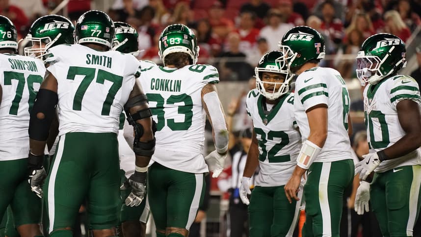 Sep 9, 2024; Santa Clara, California, USA; New York Jets guard John Simpson (76), New York Jets offensive tackle Tyron Smith (77), New York Jets tight end Tyler Conklin (83), New York Jets wide receiver Xavier Gipson (82), New York Jets quarterback Aaron Rodgers (8), and New York Jets running back Breece Hall (20) in the huddle against the San Francisco 49ers in the fourth quarter at Levi's Stadium. Mandatory Credit: David Gonzales-Imagn Images