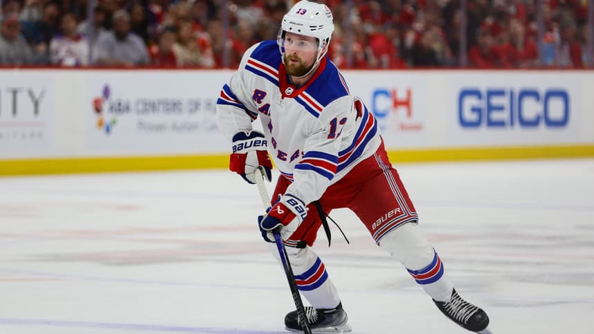 May 28, 2024; Sunrise, Florida, USA; New York Rangers left wing Alexis Lafreniere (13) moves the puck against the Florida Panthers during the first period in game four of the Eastern Conference Final of the 2024 Stanley Cup Playoffs at Amerant Bank Arena. Mandatory Credit: Sam Navarro-Imagn Images