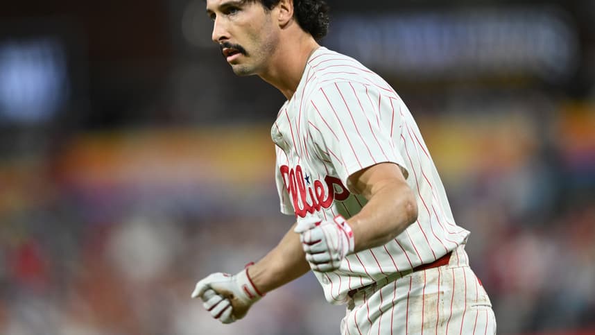 Sep 24, 2024; Philadelphia, Pennsylvania, USA; Philadelphia Phillies catcher Garrett Stubbs (21) reacts after reaching first base safely on an RBI bunt against the Chicago Cubs in the second inning at Citizens Bank Park. Mandatory Credit: Kyle Ross-Imagn Images