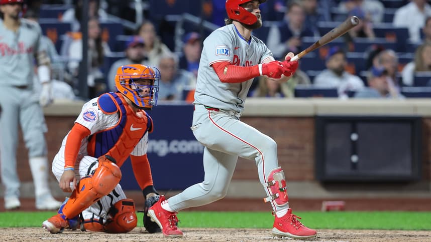 Oct 9, 2024; New York, New York, USA; Philadelphia Phillies first baseman Bryce Harper (3) hits a double in the sixth inning against the New York Mets in game four of the NLDS for the 2024 MLB Playoffs at Citi Field. Mandatory Credit: Brad Penner-Imagn Images