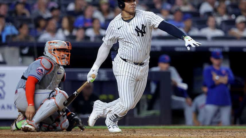 Jul 24, 2024; Bronx, New York, USA; New York Yankees right fielder Juan Soto (22) follows through on a double against the New York Mets during the seventh inning at Yankee Stadium. Mandatory Credit: Brad Penner-Imagn Images