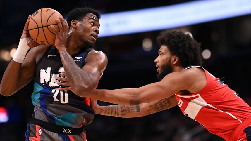 Mar 27, 2024; Washington, District of Columbia, USA;  Brooklyn Nets center Day'Ron Sharpe (20) looks to pass as Washington Wizards forward Marvin Bagley III (35) defends during the first half at Capital One Arena. Mandatory Credit: Tommy Gilligan-Imagn Images