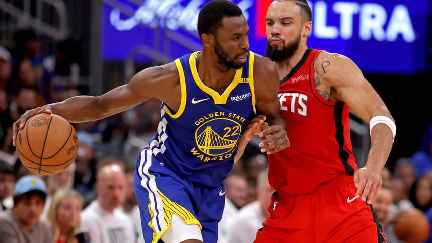 Nov 2, 2024; Houston, Texas, USA; Golden State Warriors forward Andrew Wiggins (22) handles the ball against Houston Rockets forward Dillon Brooks (9) during the third quarter at Toyota Center. Mandatory Credit: Erik Williams-Imagn Images