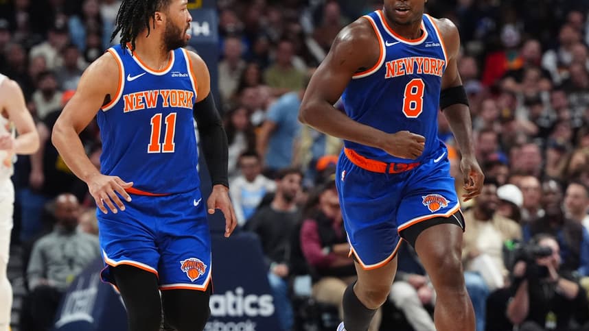 Nov 25, 2024; Denver, Colorado, USA; New York Knicks guard Jalen Brunson (11) reacts towards forward OG Anunoby (8) in the second quarter against the Denver Nuggets at Ball Arena. Mandatory Credit: Ron Chenoy-Imagn Images