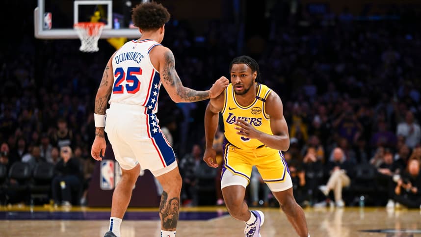 Nov 8, 2024; Los Angeles, California, USA; Los Angeles Lakers guard Bronny James (9) runs past Philadelphia 76ers guard Lester Quinones (25) during the second half at Crypto.com Arena. Mandatory Credit: Jonathan Hui-Imagn Images
