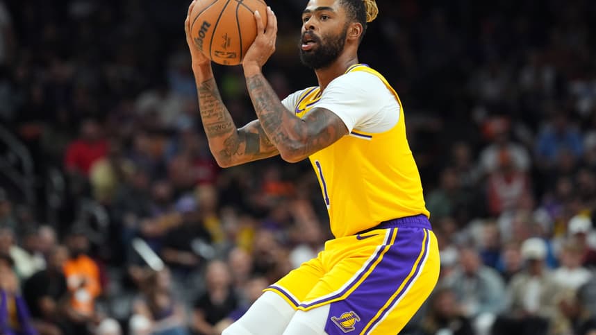 Oct 17, 2024; Phoenix, Arizona, USA; Los Angeles Lakers guard D'Angelo Russell (1) shoots against the Phoenix Suns during the second half at Footprint Center. Mandatory Credit: Joe Camporeale-Imagn Images